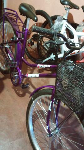 2 Bicicleta mod. Tropical 1 vermelha met.cesta e 1 lilas