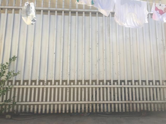 Portao de grade com chapa