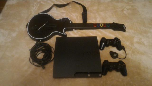 Ps3 com mais de 40 jogos + guitarra
