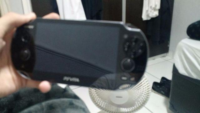 Ps vita semi novo com dois jogo original
