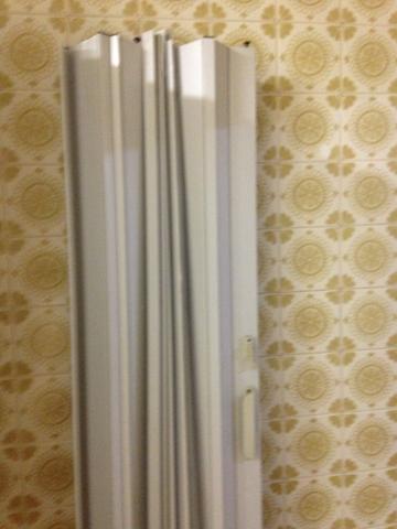 Porta sanfonada usada