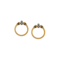 Alexander McQueen Par de brincos de argolas com caveira - Dourado