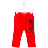 Moschino Kids Calça jeans com estampa de logo - Vermelho