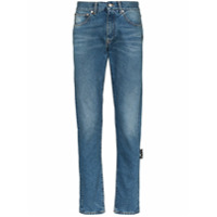 Off-White Calça jeans slim com listras diagonais - Azul