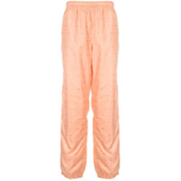 Supreme Calça cenoura com estampa de logo - Laranja