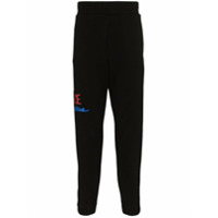 Versace Calça esportiva de algodão com estampa de logo - Preto